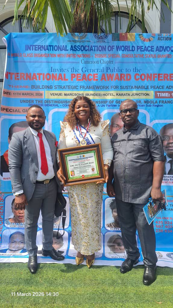 Peace volunteer receiving certificate on stage